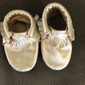 Cute little gold moccasins